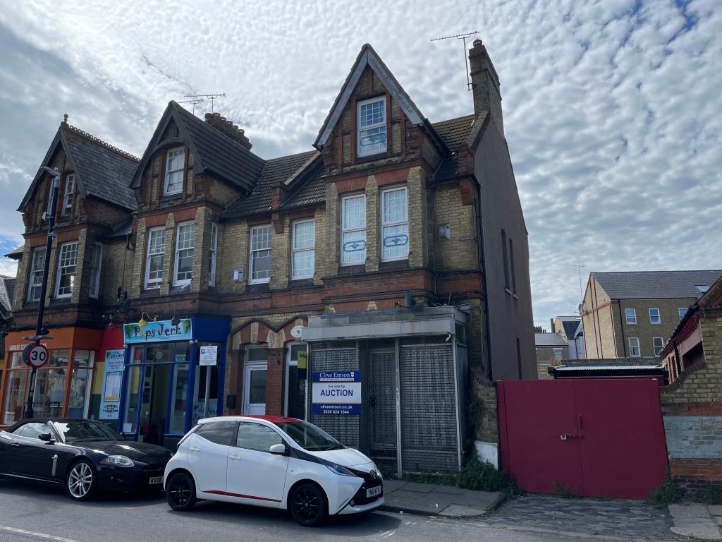 Lot: 144 - END-TERRACE PROPERTY ARRANGED AS THREE-BEDROOM HOUSE - Three storey end of terrace with bay windows